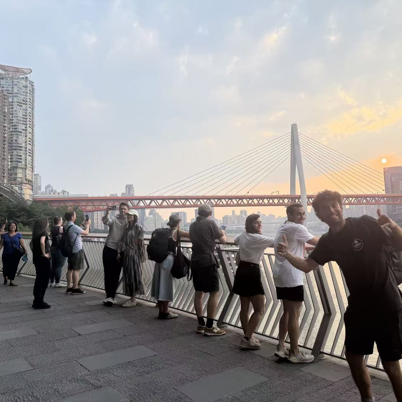 Elias walking with a diverse guest group in downtown Chongqing