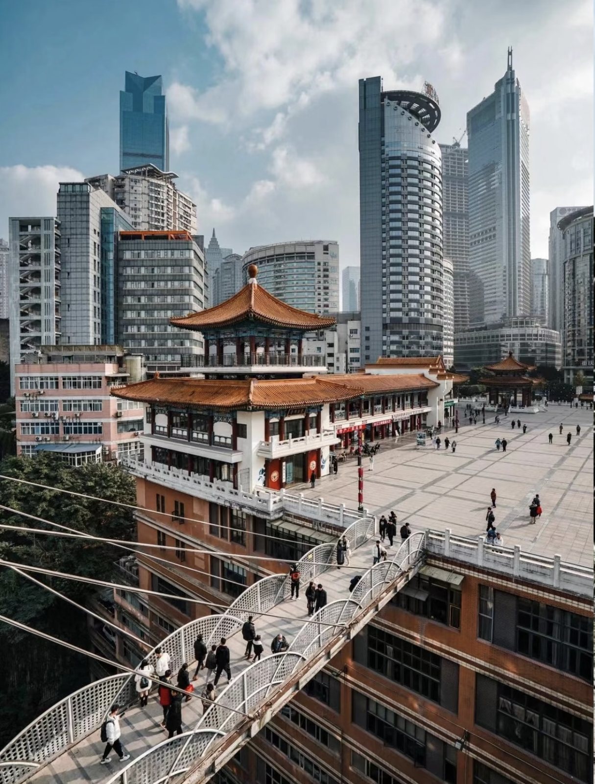 Kuixinglou's traditional roofs, sky bridges and modern Chongqing towers