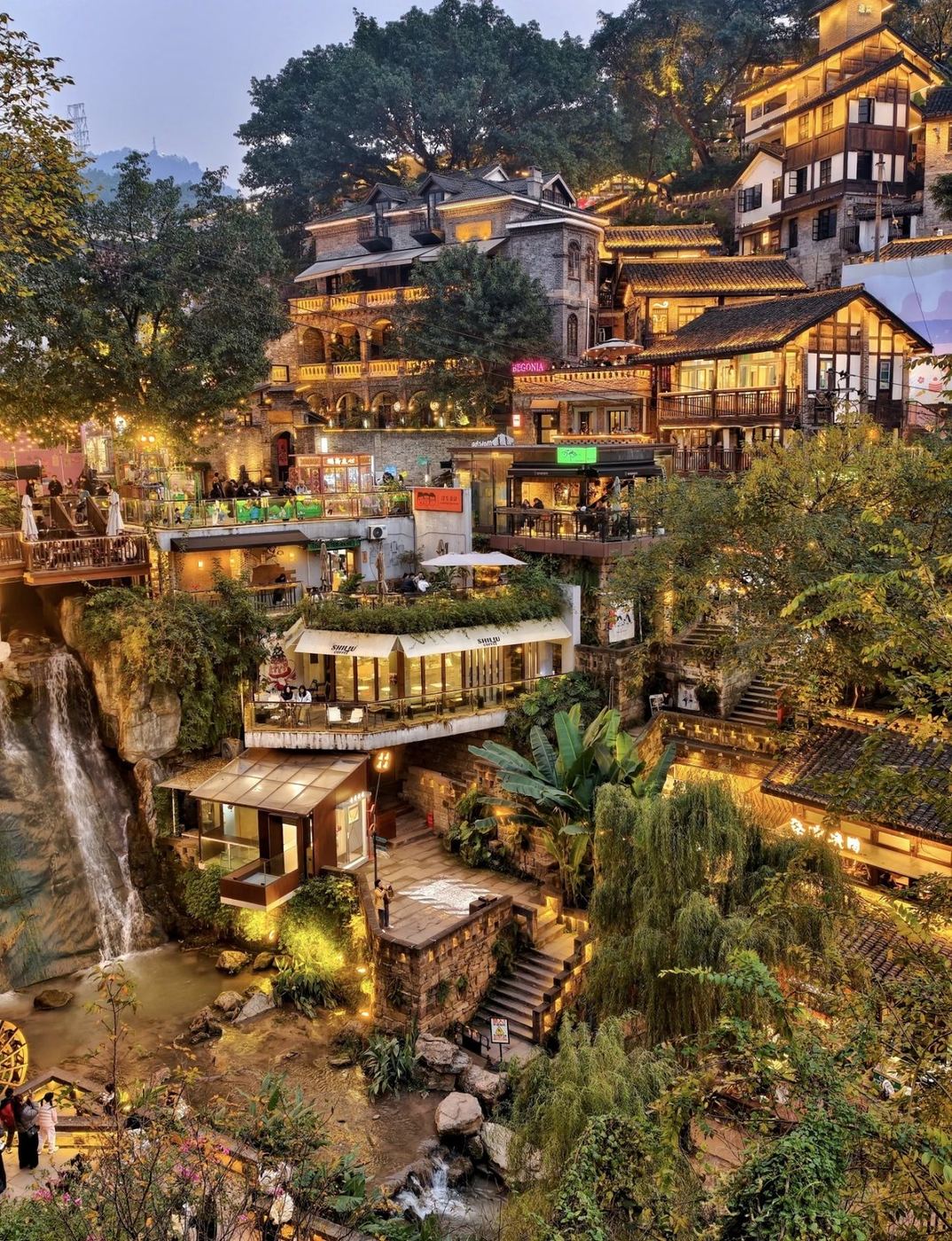 Historic riverside buildings and illuminated lanes around Xiahaoli
