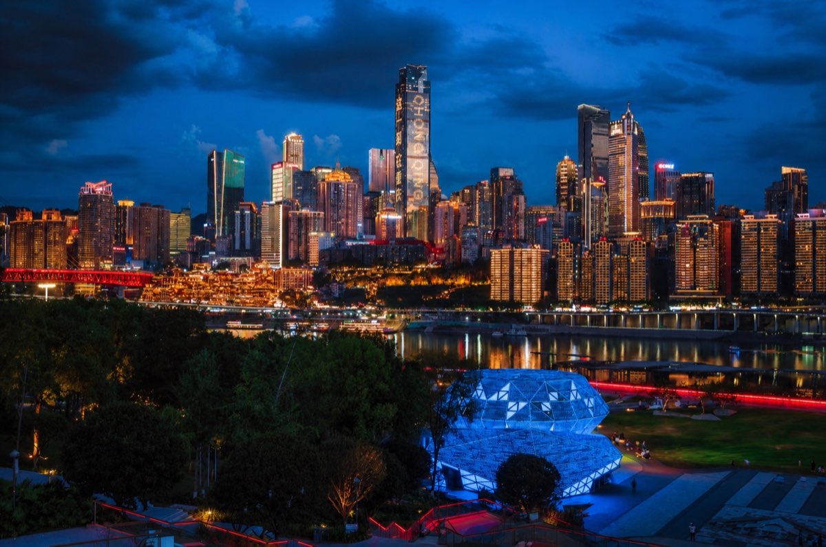 The illuminated Chongqing skyline seen from Diamond Square
