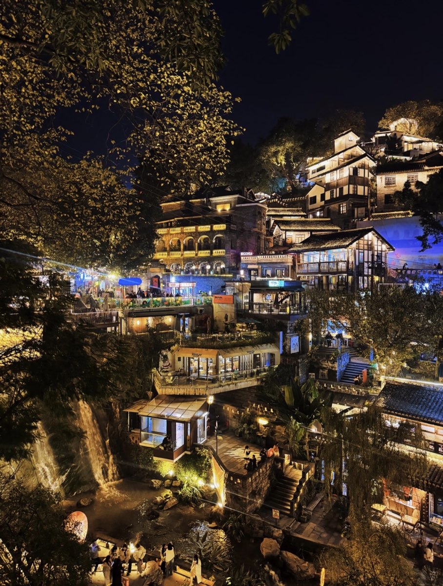 Shancheng Alley's hillside buildings illuminated after dark